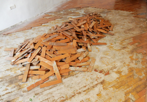 a pile of wood flooring that has been removed
